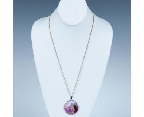 The pendant is an example of the unique Murano glass millefiori technique. It measures 1.5"dia. and is set in a gold-plated s