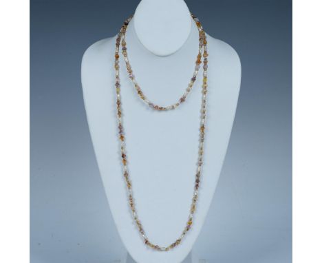 Two necklaces with faux pearls, gemstone chips, small gold metal spacer beads, and spring ring clasps that have the Napier st