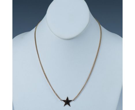 Gold metal chain with a star and spring ring clasp that has a tag stamped Avon. It measures approximately 18.5"L. Manufacture