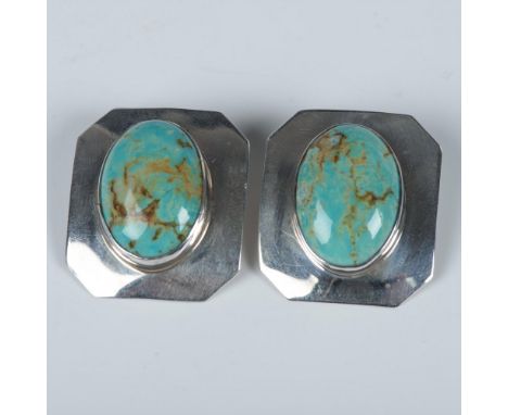 Bold Southwest Native American clip-on earrings with unique turquoise stones set in sterling silver. Sterling stamps on the b