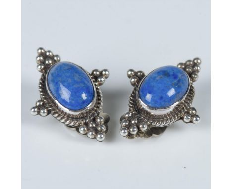 Beautiful handmade Southwestern Native American clip-on earrings with blue lapis lazuli stones set in sterling silver. Artist