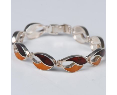 Flowing wave shaped links of multi color amber set in sterling silver form this lovely bracelet. Hinged between each section 