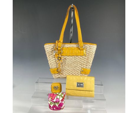 Straw handbag with dark yellow leather shoulder straps and accents, interior pockets and zippered closure; 13"L x 4"W x 8.75"