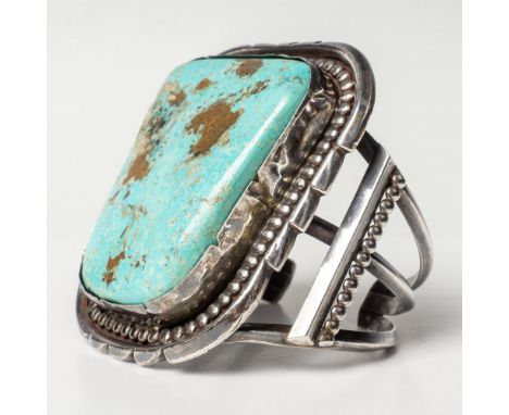 Oversized stone set in beaded, crimped silver housing on a cuff with bar and bead detail. Silver is unmarked but tested sterl