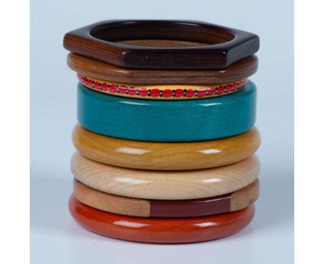 8 wood bangle bracelets in different sizes, colors, and shapes. The measure approximately 2.5"dia on the inside. Condition: A