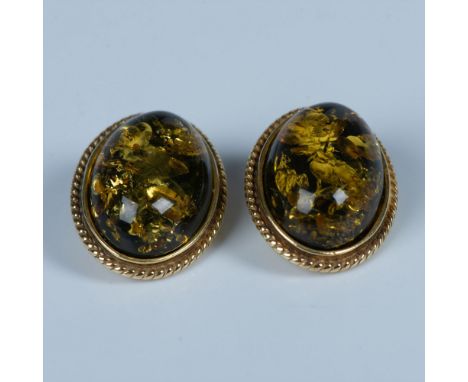 Beautiful amber stones set in gold-washed sterling silver. Stamped 925 on the backs. They measure approximately 0.75"L x 0.5"