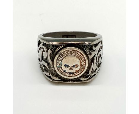 Chunky band with skull emblem and carved flames on either side. Titanium and 925 stamped inside band. Size 13. Condition: Age