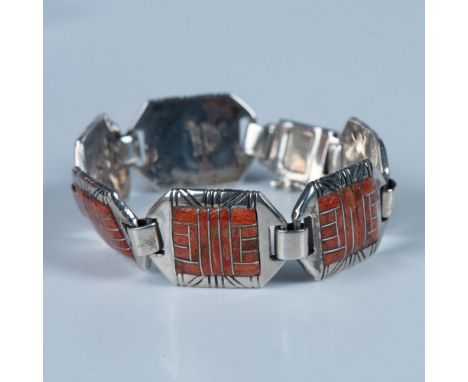 Beautiful Southwestern Native American bracelet with hand crafted sterling silver links featuring a geometric pattern coral i