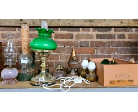QTY OF VINTAGE SMALL STYLE OIL LAMPS INCL; A MODERN ELECTRICAL COPY &amp; VARIOUS GLASS CHIMNEY'S
