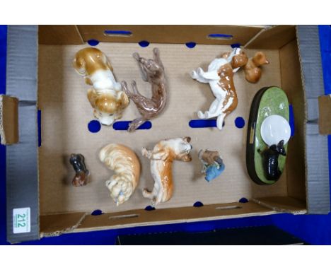 A mixed collection of ceramic dog figures including Beswick King Charles Spaniel, Sharing Tableau Piece  together with simila