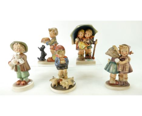 Five Hummel figures to include a boy with piglets ( tails chipped), boy &amp; girl under an umbrella, Boy with a dog ( ears c