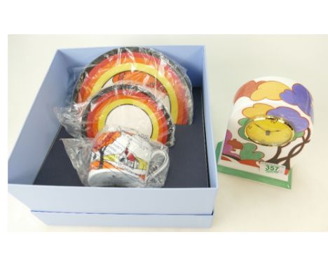 Wedgwood Clarice Cliff clock ( certificate) together with a Clarice Cliff Trio (boxed) (2) 