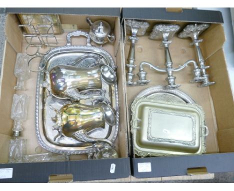 A collection of silver plated items including candlesticks, Candelabra, tea set, serving platters, condiment set etc(2 trays)