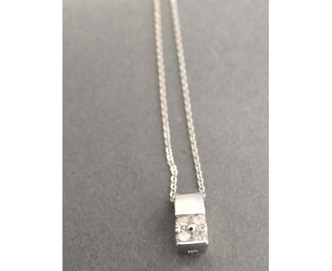 An 18ct. White Gold Diamond Pendant with white gold chain