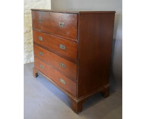 An Early 19th Century Military Secretaire Chest, the moulded top above a fully fitted secretaire drawer with alcoves and draw