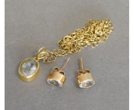 A 9ct. Gold Pendant with Chain, together with a pair of matching ear studs set blue stone