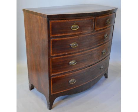 A 19th Century Mahogany Bow Front Chest of Drawers, the satinwood inlaid top above two short and three long drawers with oval