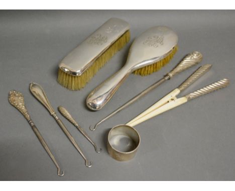 An 800 Mark Silver Backed Dressing Table Brush together with another similar, a silver napkin ring, four silver handled butto