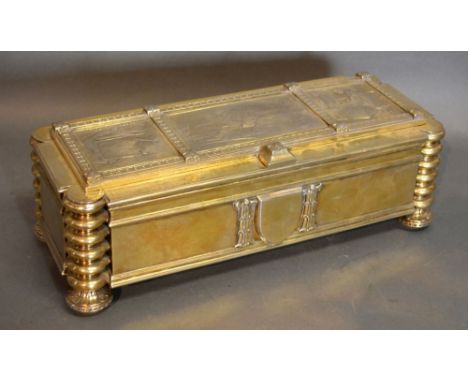 Omar Ramsden, A Large Silver Gilt Casket, the hinged top decorated in relief with three panels depicting figures swimming, a 