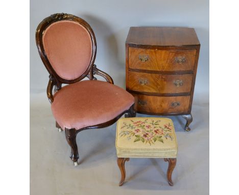 A Victorian Walnut Low Seat Nursing Chair, together with a tapestry topped foot stool and a walnut three drawer bedside chest