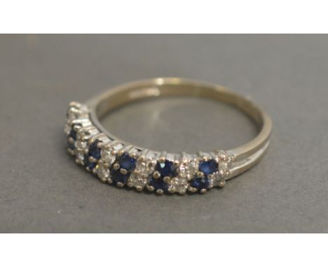 An 18ct White Gold Diamond and Sapphire Set Half Hoop Band Ring