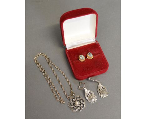 A Pair of Yellow Metal Oval Ear Studs set Blue Stone, together with a marcasite set pendant with chain and a pair of similar 