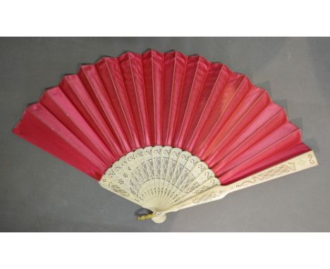 A 19th Century Carved Ivory Fan with Pierced Sticks and Double Satin Rose Coloured Leaf, Metal Loop with Mother of Pearl Butt
