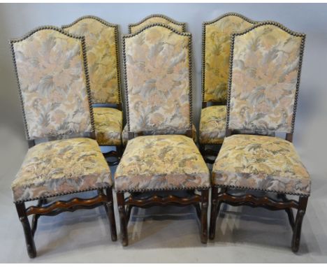 A Set of Six French High Back Dining Chairs, with a tapestry type back and seat with metal studs raised upon shaped legs with