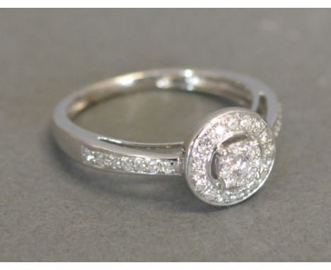 A 9ct. White Gold Diamond Cluster Ring, approximately 0.25ct