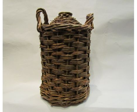 A commemorative cask one gallon Navy Rum flagon in wicker surround. A decade of celebration and commemoration in Honour of Vi
