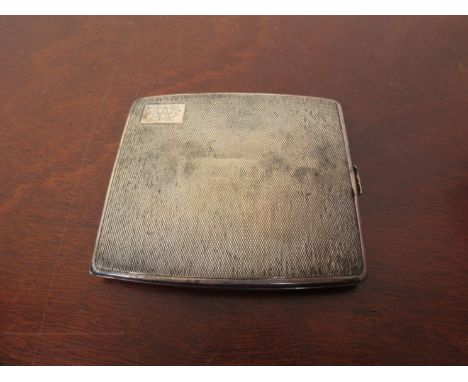 A silver cigarette case with engine turned case, London 1933, 107g