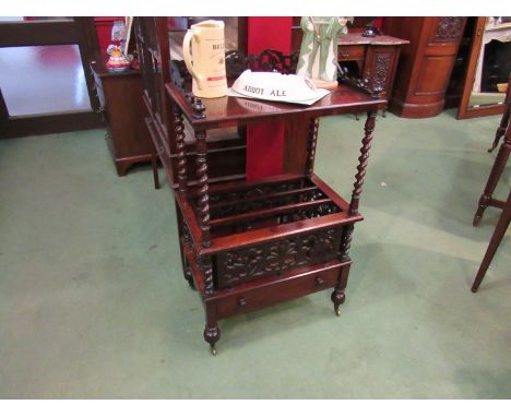 A mid 19th Century rosewood Canterbury with galleried upper shelf on barleytwist supports, barleytwist supports, fretwork pan