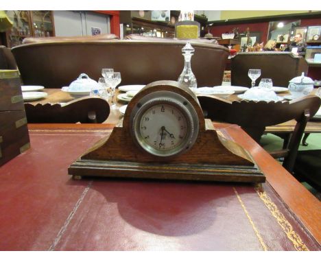 A Smiths eight day car clock mounted into an oak mantel clock case
