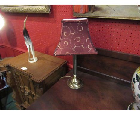 A brushed brass table lamp with fluted column and burgundy/gold shade 