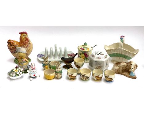 A quantity of ceramics to include Easter themed Adderley bunny eggcups; Wedgwood Peter Rabbit Christening money box; Beswick 