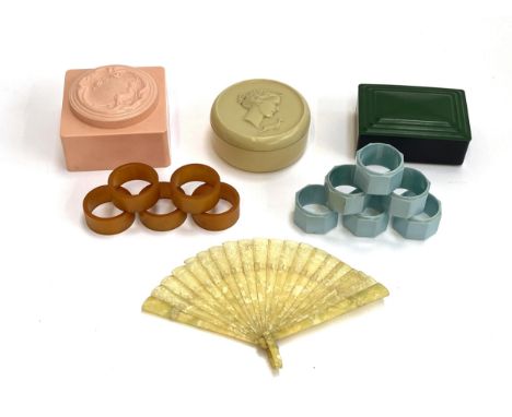 A quantity of early 20th century and Art Deco plastic items to include a set of five amber coloured bakelite napkin rings, ce