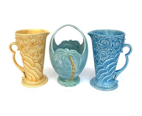 A pair of Wade jugs, 23cmH, together with a Beswick blue basket vase