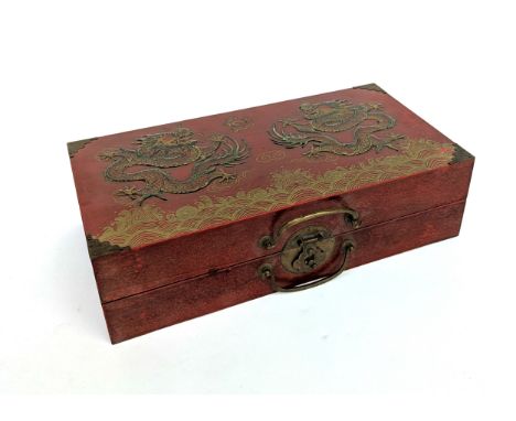 A Chinese cased chess set with resin figures, 41cmW