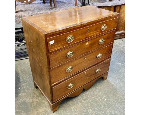 A George III mahogany chest of four graduating drawers, oval pressed metal handles, on shaped apron, and bracket feet, 86x47x