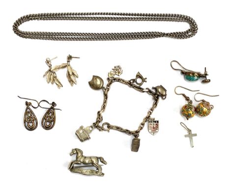 A white metal charm bracelet, having a 900 silver and enamel 'Igls' charm; a pair of 925 silver Celtic drop earrings; Cloison