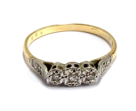 An 18ct gold and platinum trilogy ring illusion set with three diamonds, size P 1/2, gross weight 2.2g