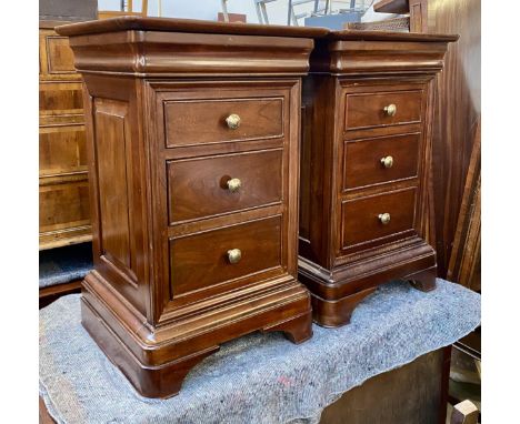 A pair of John Lewis bedside cabinets, each with single cushion drawer over three further drawers on bracket feet with panell