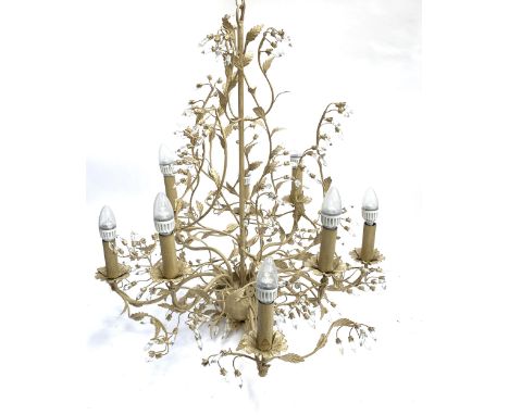 A painted wrought metal eight armed chandelier