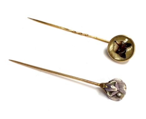 An Art nouveau gold, diamond and enamel stickpin in the form of an iris (enamel af), 2.6g; together with a 20th century rever