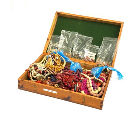 A large quantity of vintage beaded necklaces in a wooden box, to include agate beads, plastic beads, opaline crackle glass be