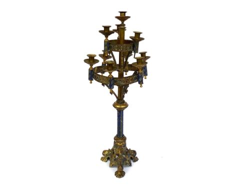 A continental cold painted gilt metal ecclesiastical candlestick with ten nozzles, 75cmH (in need of some repair)