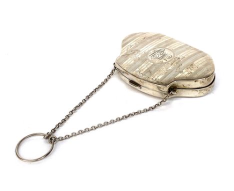 An Edwardian silver chatelaine purse, engine turned, with brown leather interior, 9.5cm wide, 83g overall