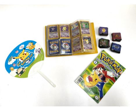 Pokemon interest: a small quantity of approx. 60 pokemon TCG cards in a folder, including Jungle, Fossil and Team Rocket card