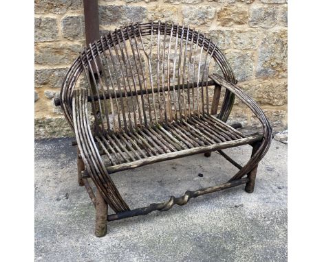 A fan back bent willow/hazel two seat garden bench, approx. 126cm wide
