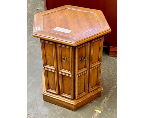 A hexagonal lamp table with single panelled door, 46x56cmH